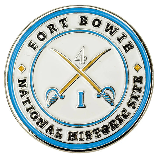 Circular badge with 'Fort Bowie National Historic Site' text and crossed swords design on a white background