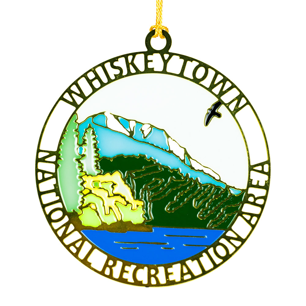 Decorative ornament with 'Whiskeytown National Recreation Area' text and mountain landscape illustration.