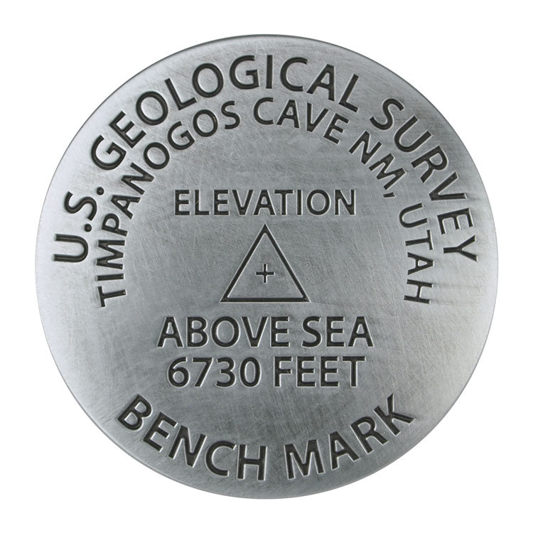 Geological survey benchmark with U.S. Geological Survey text and elevation details on a white background