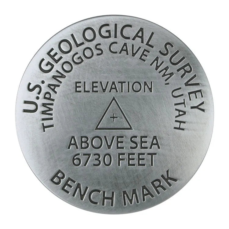 Geological survey benchmark with U.S. Geological Survey text and elevation details on a white background