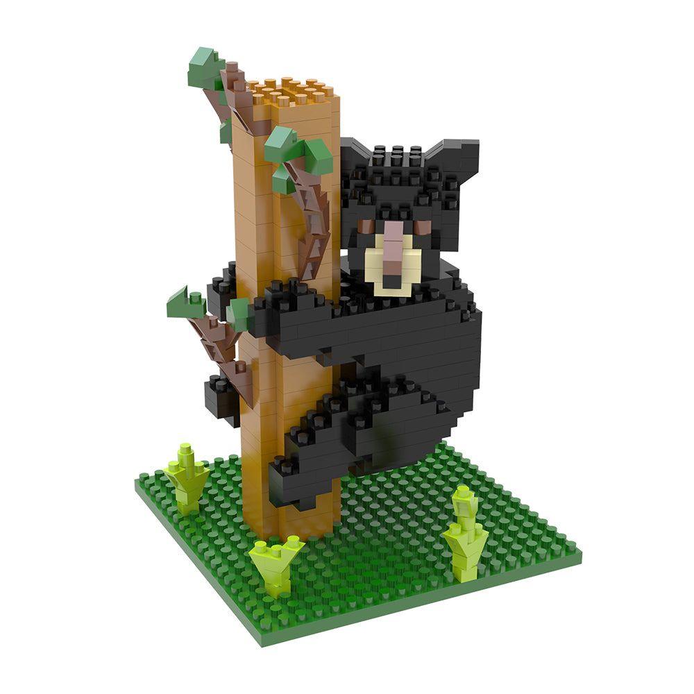 Mini block set of a black bear climbing a tree on a white background