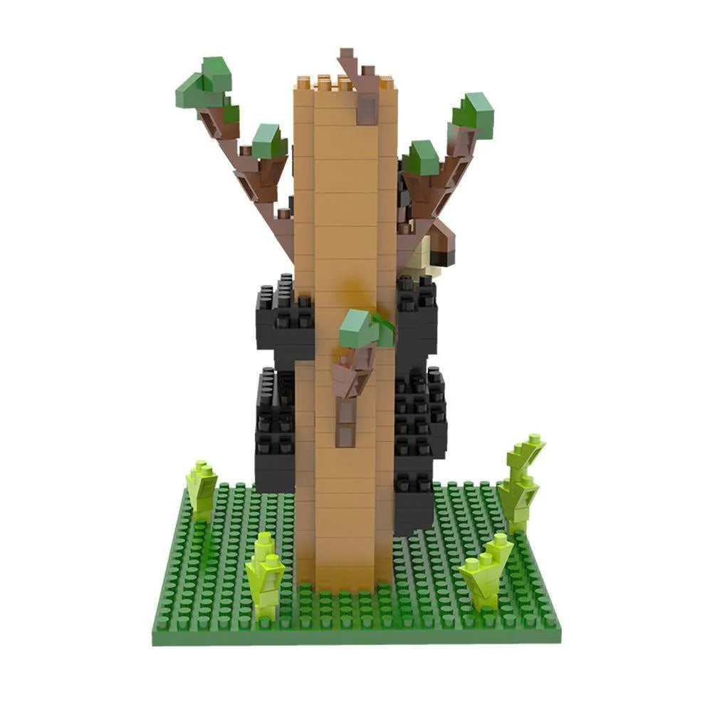 Mini block set of a black bear climbing a tree on a white background