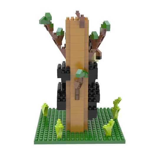 Mini block set of a black bear climbing a tree on a white background