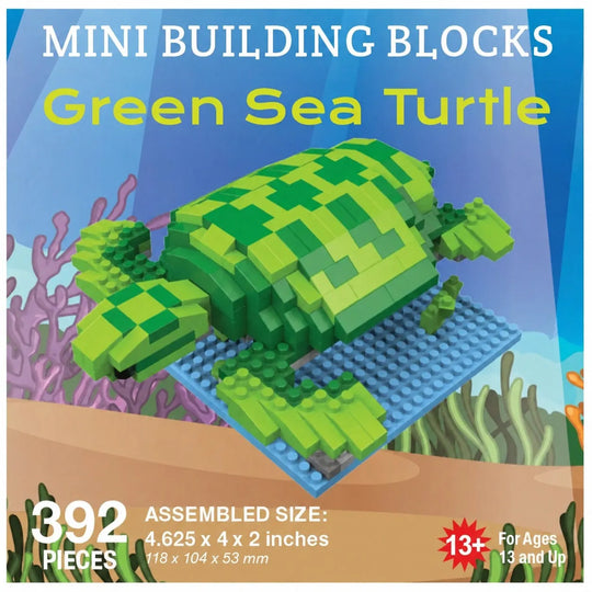 Packaging for a mini building blocks set featuring a green sea turtle assembled from 392 pieces on a blue baseplate, with underwater coral scenery. Text includes &