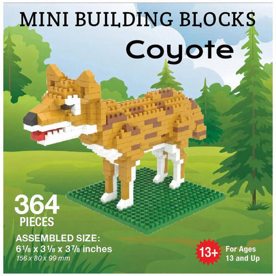 Mini Building Blocks Coyote toy set packaging showing a coyote built from tan, brown, white, and black blocks standing on a green base against a forest background. Text includes &