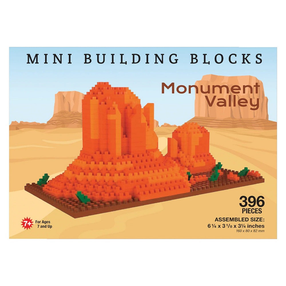 Box of mini building blocks shaped like Monument Valley with desert landscape illustration.
