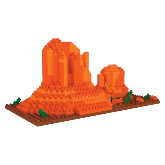 Mini building blocks shaped like Monument Valley against a white background.