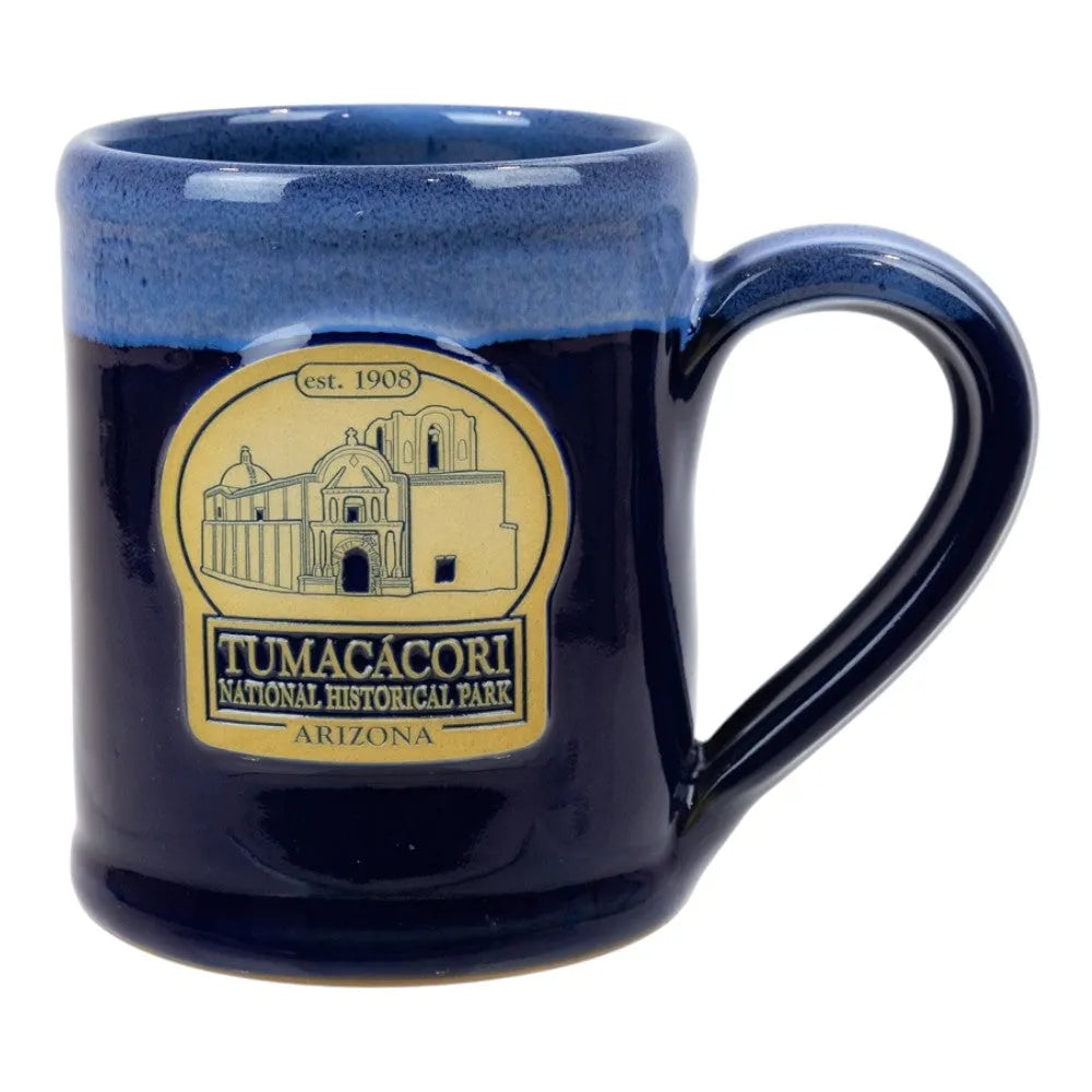 Navy blue mug with Tumacacori National Historical Park logo on a white background