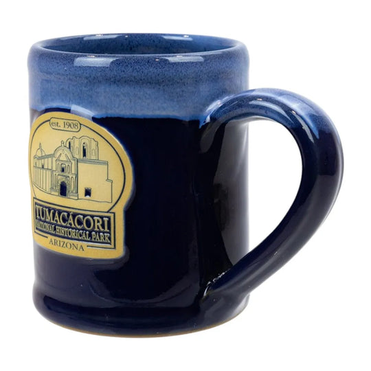 Navy blue mug with Tumacacori National Historical Park logo on a white background