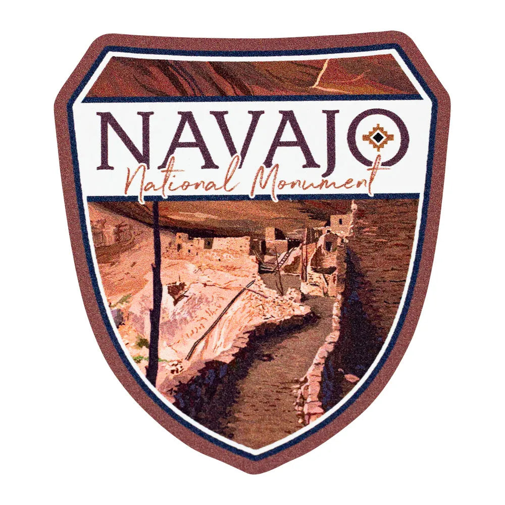 Navajo National Monument logo with desert landscape and wooden border