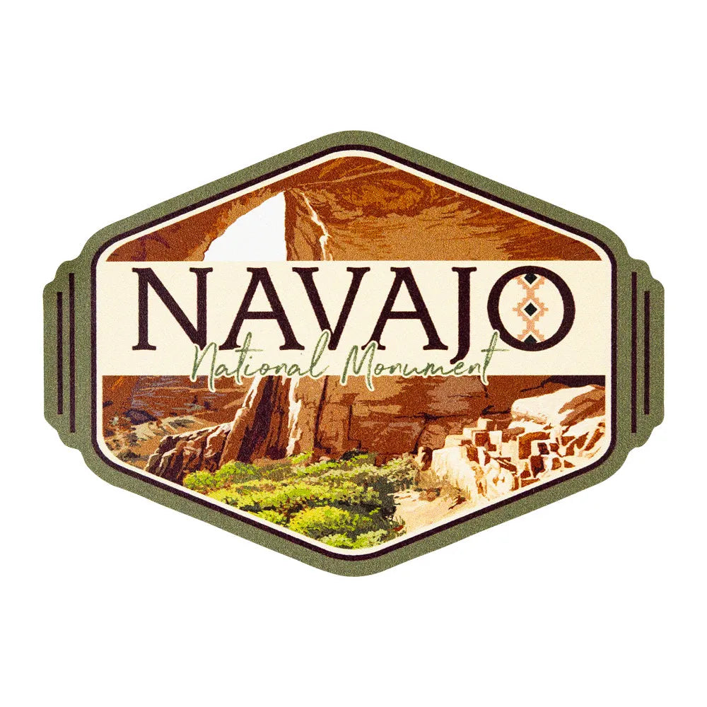 Logo of Navajo National Monument with desert landscape and rock formations.
