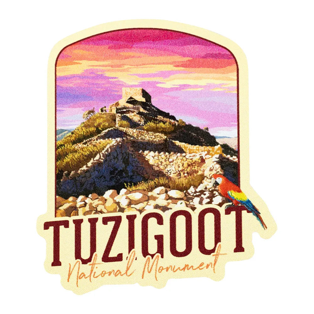 Sticker of Tuzigoot National Monument with a colorful parrot and mountain landscape.