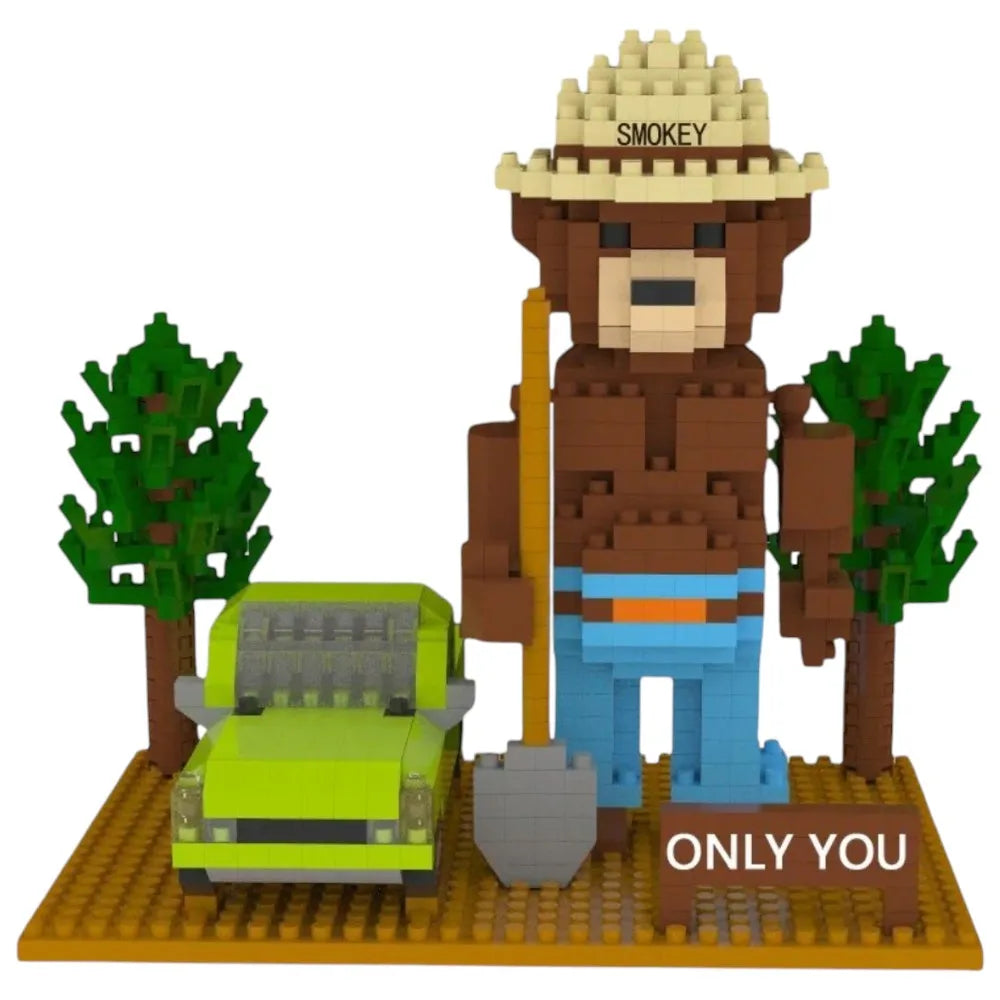 LEGO-like bear figure with a hat and backpack, holding a shovel, with trees and a car on a white background.