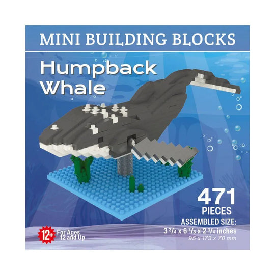 Box of mini building blocks of a humpback whale with blue water background