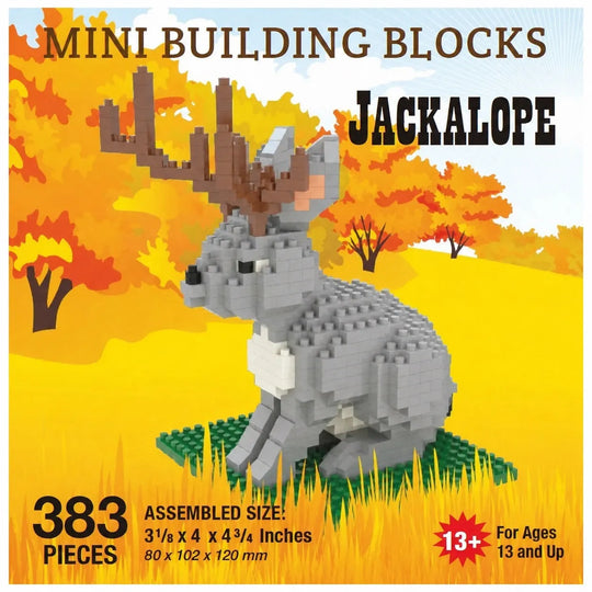 Box-style product graphic for a mini building blocks set featuring an assembled jackalope rabbit made of gray and white blocks with brown antlers, set against a yellow autumn landscape with orange trees. Text reads &