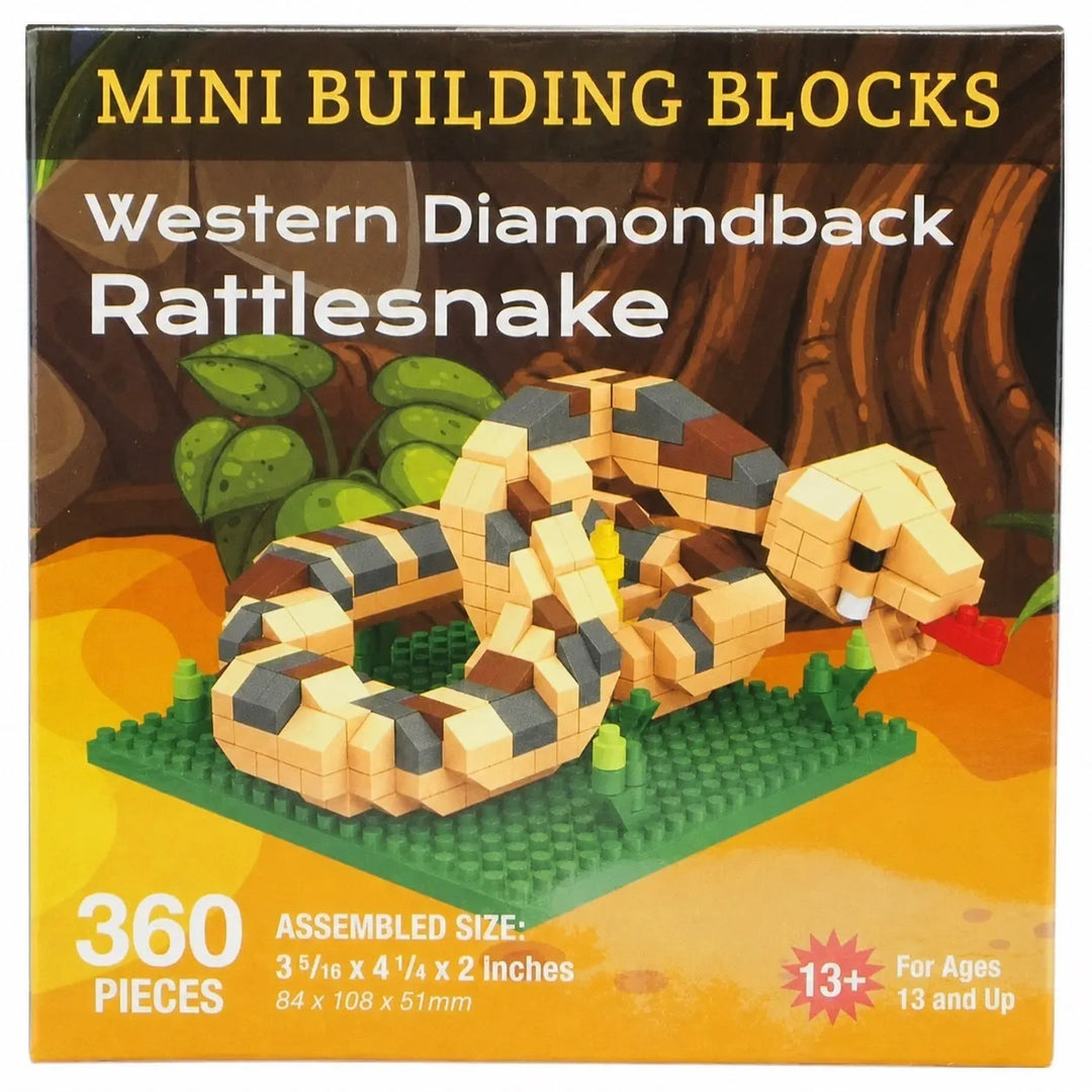 Front of a building blocks box for the Western Diamondback Rattlesnake set. The packaging shows a assembled tan, black, and brown snake on a green base against a jungle-style background, with text reading &