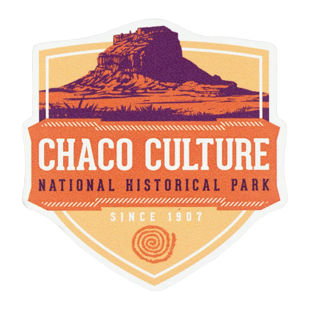 Sticker of Chaco Culture National Historical Park with a purple cliff dwelling on an orange background.