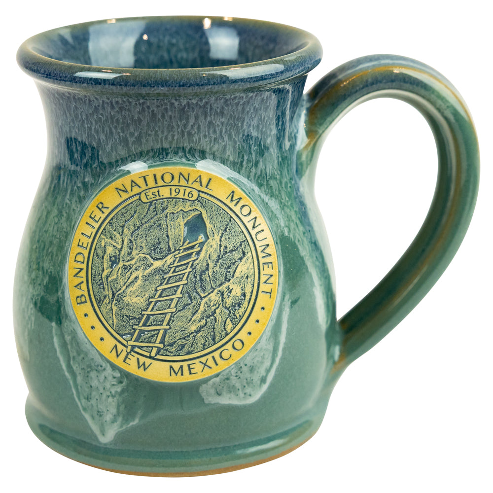 Bandelier National Monument Tall Belly Mug in greenish blue on a white background
