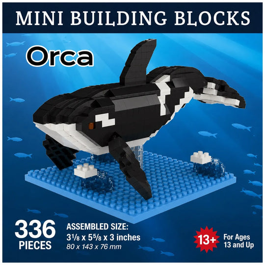 Mini building blocks set featuring an assembled orca whale model on a blue baseplate, with text reading &