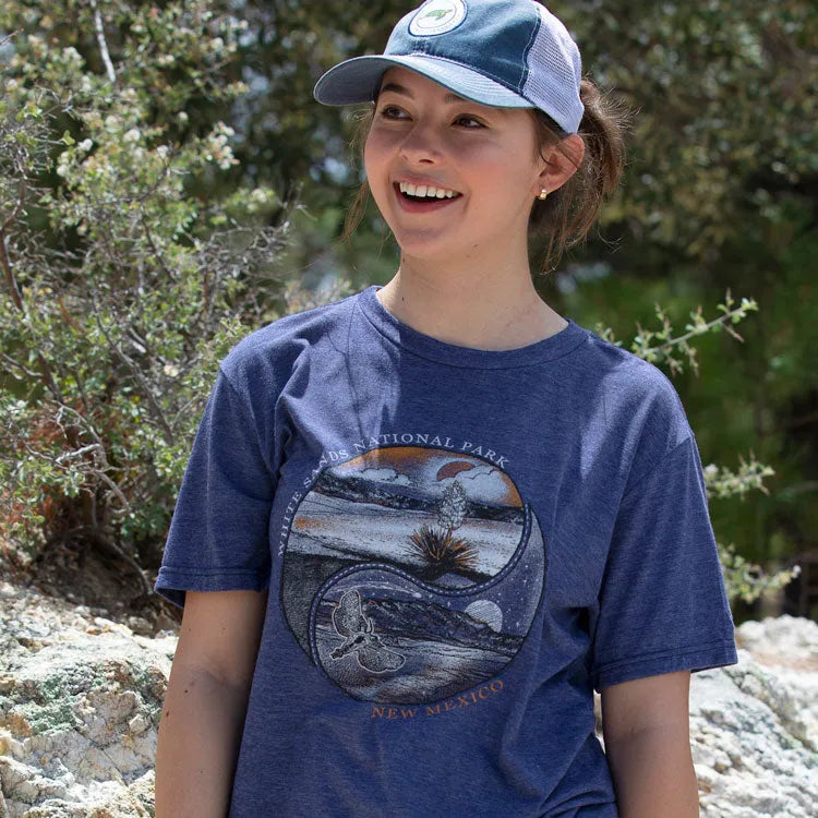 Young woman in national park shirt and cap out in nature
