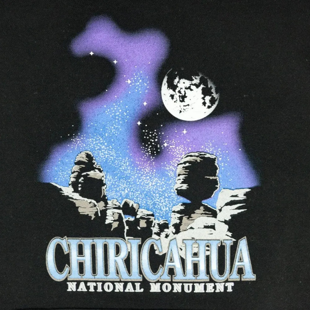Design of Chiricahua National Monument with stone figures and a moon in the sky on black fabric