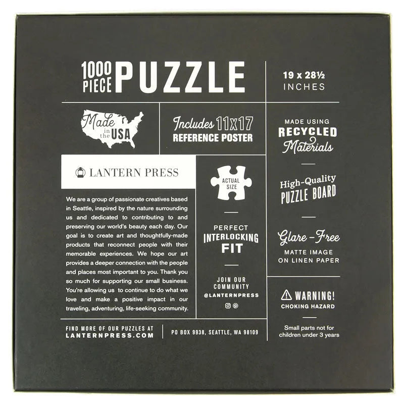 The back of a 1000-piece puzzle box by Lantern Press, featuring a dark charcoal background with white text and graphics detailing product features, materials, and company information.