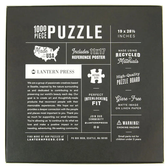 The back of a 1000-piece puzzle box by Lantern Press, featuring a dark charcoal background with white text and graphics detailing product features, materials, and company information.