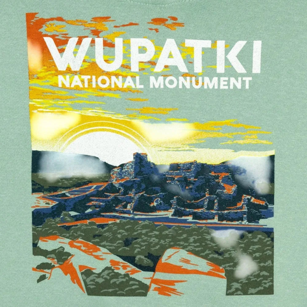 Artistic depiction of Wupatki National Monument with colorful landscape and text on a light green background.