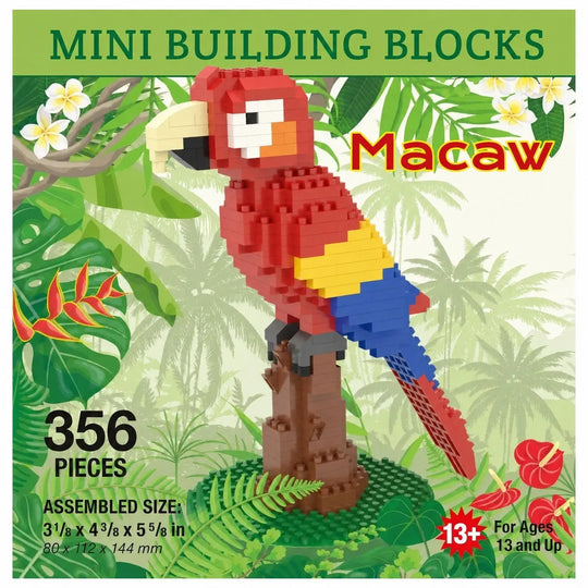 A building block set package for a macaw parrot, showing an assembled red, yellow, blue, and beige macaw standing on a brown branch. The package includes tropical jungle artwork, text reading &