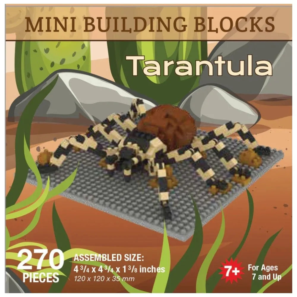 Box of mini building blocks shaped like a tarantula with desert landscape design.