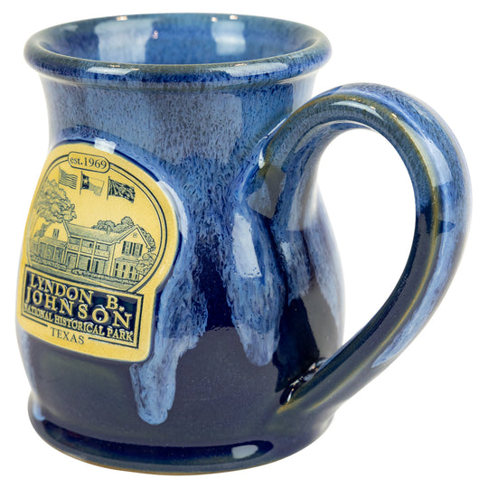 Blue ceramic mug featuring text and graphics on a white background