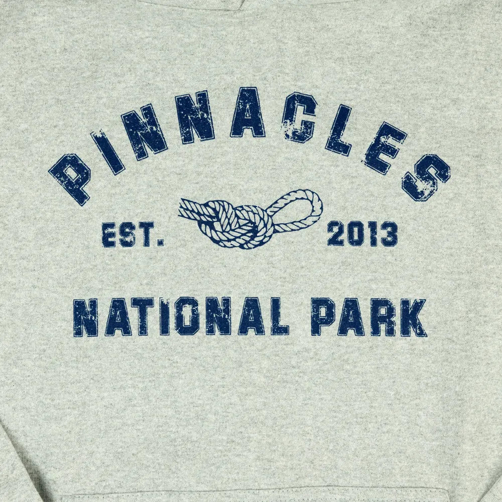 Gray sweatshirt with 'Pinnacles National Park' text and logo in blue.
