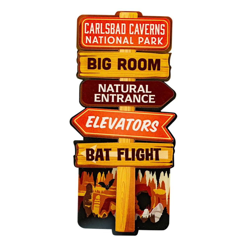 A novelty sign shaped like a wooden post with multiple directional signs reading &