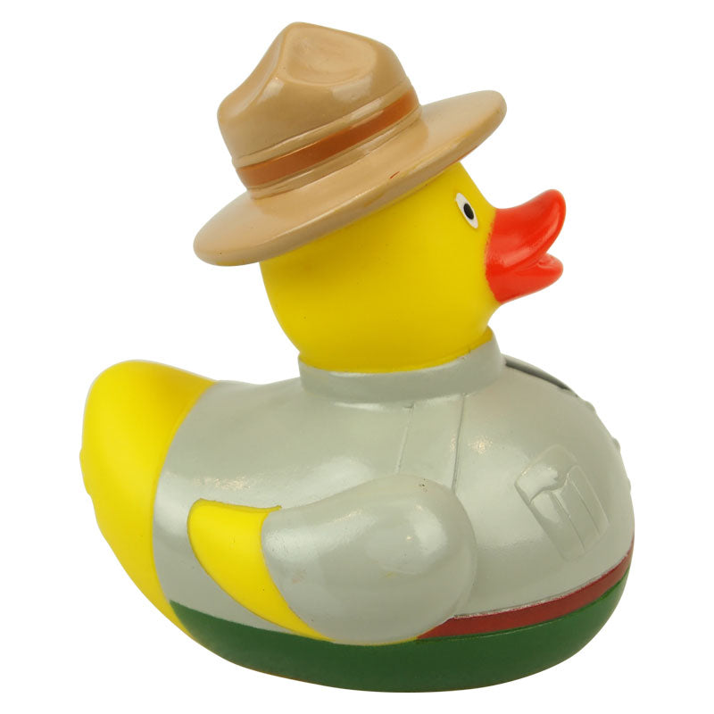 Yellow rubber duck wearing a hat on a white background