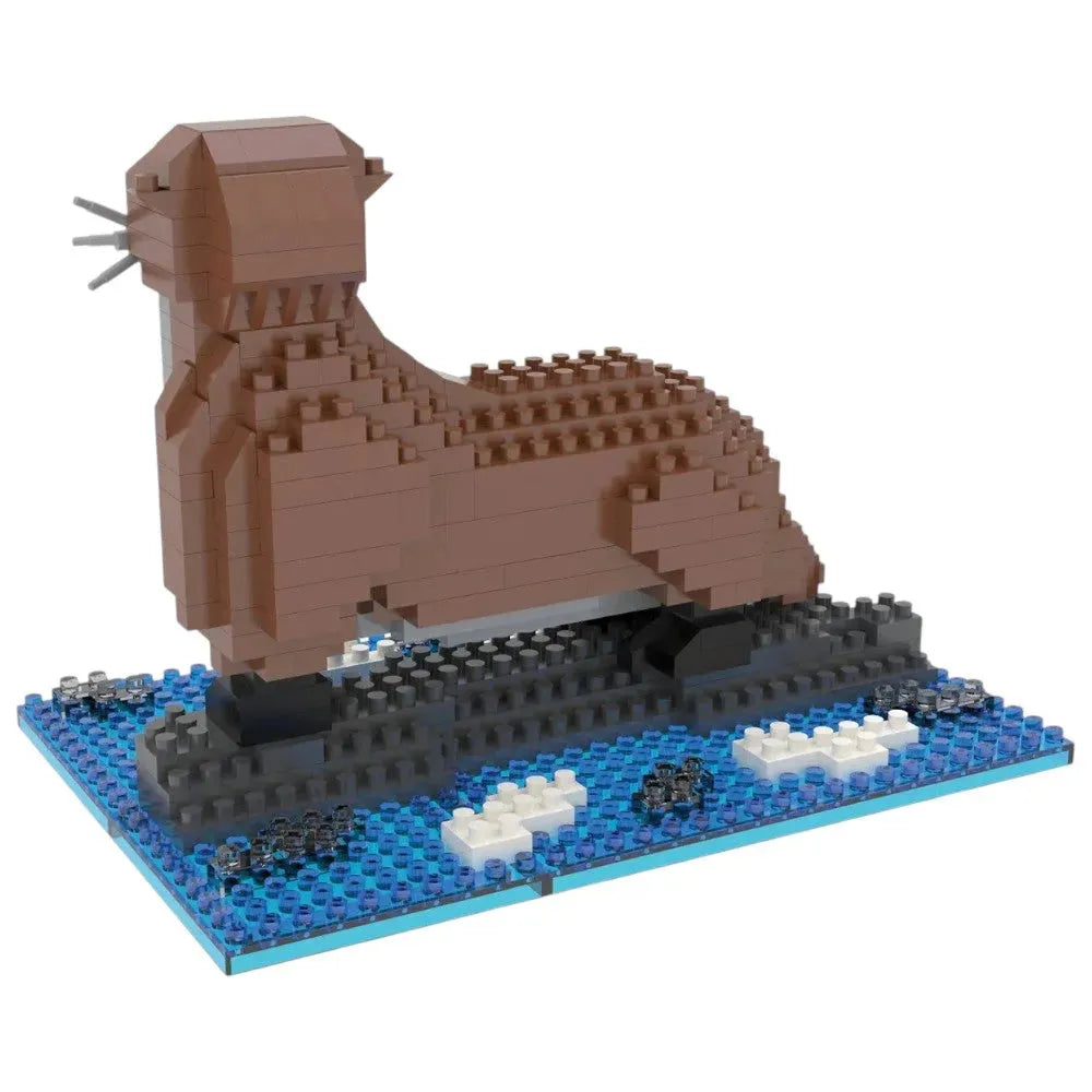 Back view of a toy river otter made of interlocking bricks on a white background