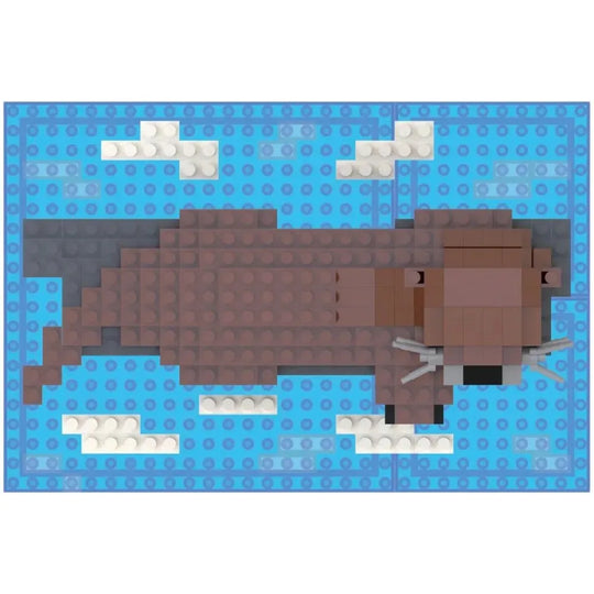 Top view of a toy river otter made of interlocking bricks on a white background