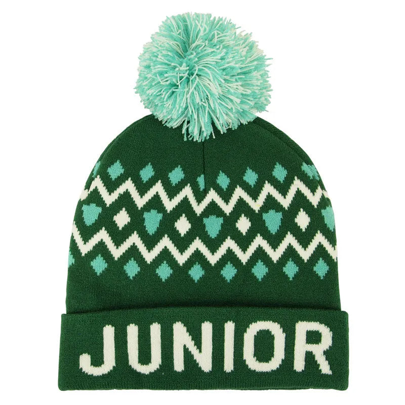 A green and white geometric patterned beanie with a pom-pom on top, featuring the text JUNIOR RANGER around the rim.