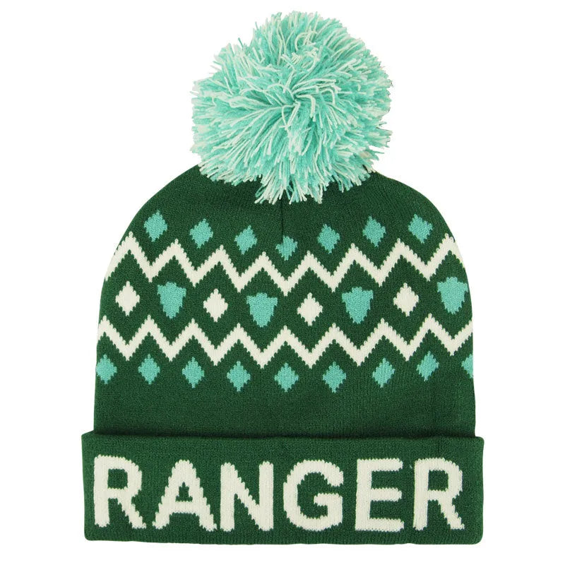 A green and white geometric patterned JUNIOR RANGER beanie with a pom-pom on top.