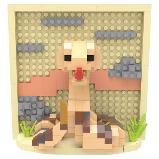 A block-built toy model of a rattlesnake, constructed from interlocking plastic bricks, set against a beige stud-patterned backdrop with gray and peach accents.