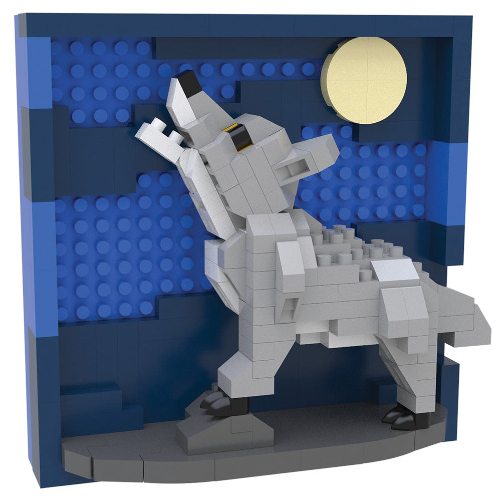 A block-built toy model of a howling wolf standing on a dark gray base, set against a blue brick-patterned backdrop with a pale yellow moon, shown on a plain white background.