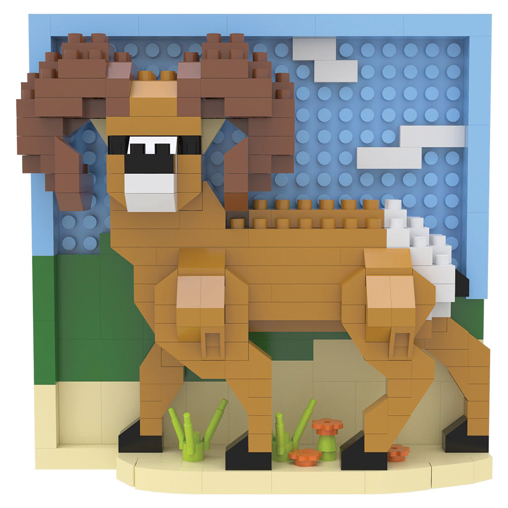 A block-style toy model of a brown ram or goat with large curved horns, built from interlocking bricks, shown against a blue and green backdrop with small plant and flower details.
