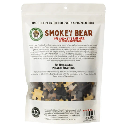 Smokey Bear-themed wooden puzzle packaging with puzzle pieces visible