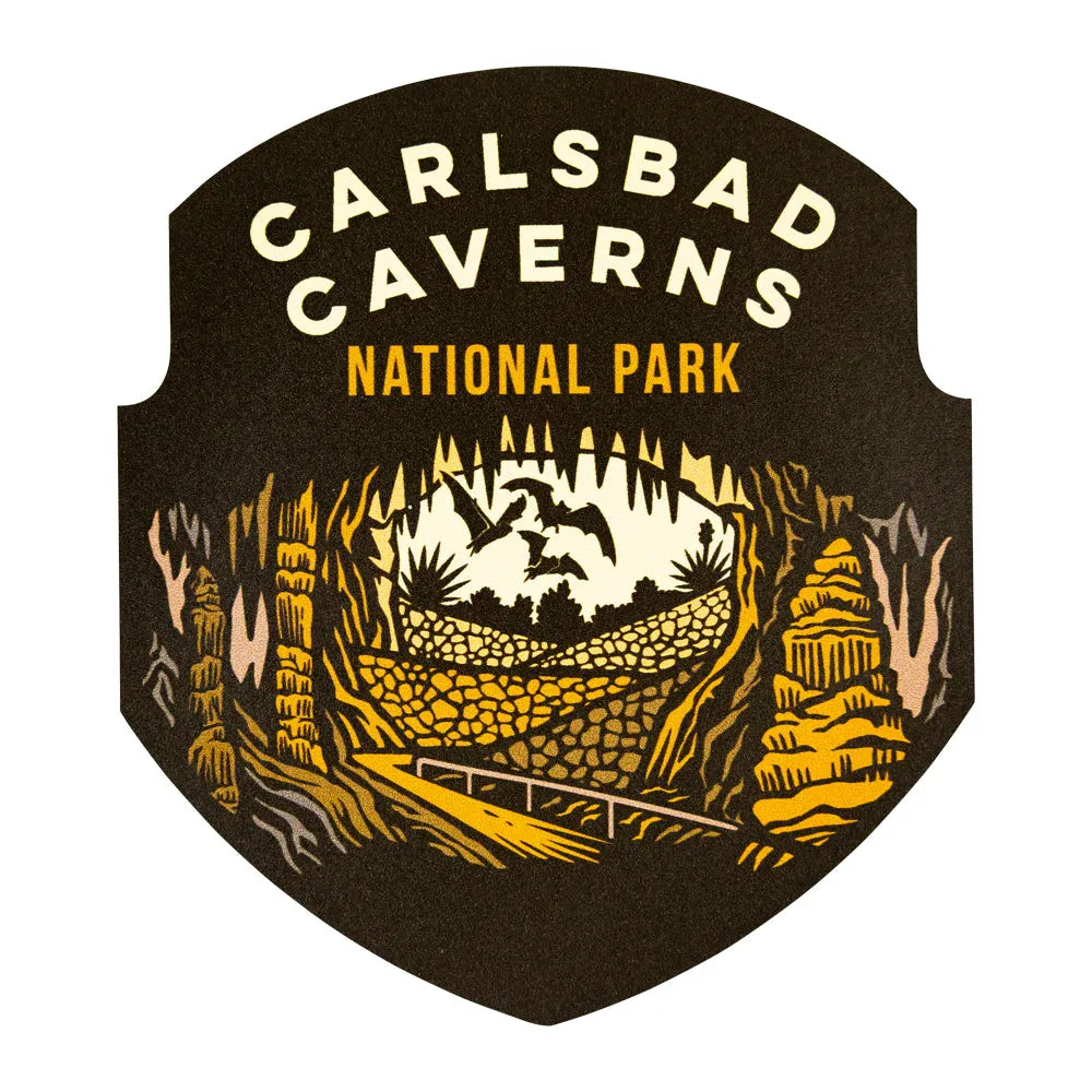 Carlsbad Caverns National Park logo sticker with yellow text and cave illustration on a black background
