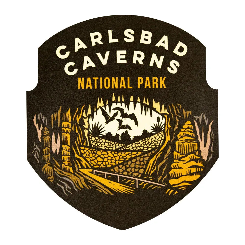 Carlsbad Caverns National Park logo sticker with yellow text and cave illustration on a black background