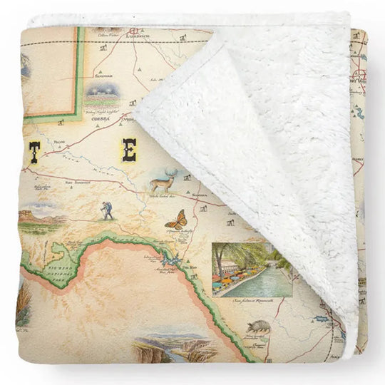 A fleece blanket with a detailed map of Texas printed on it, including national parks and monuments.