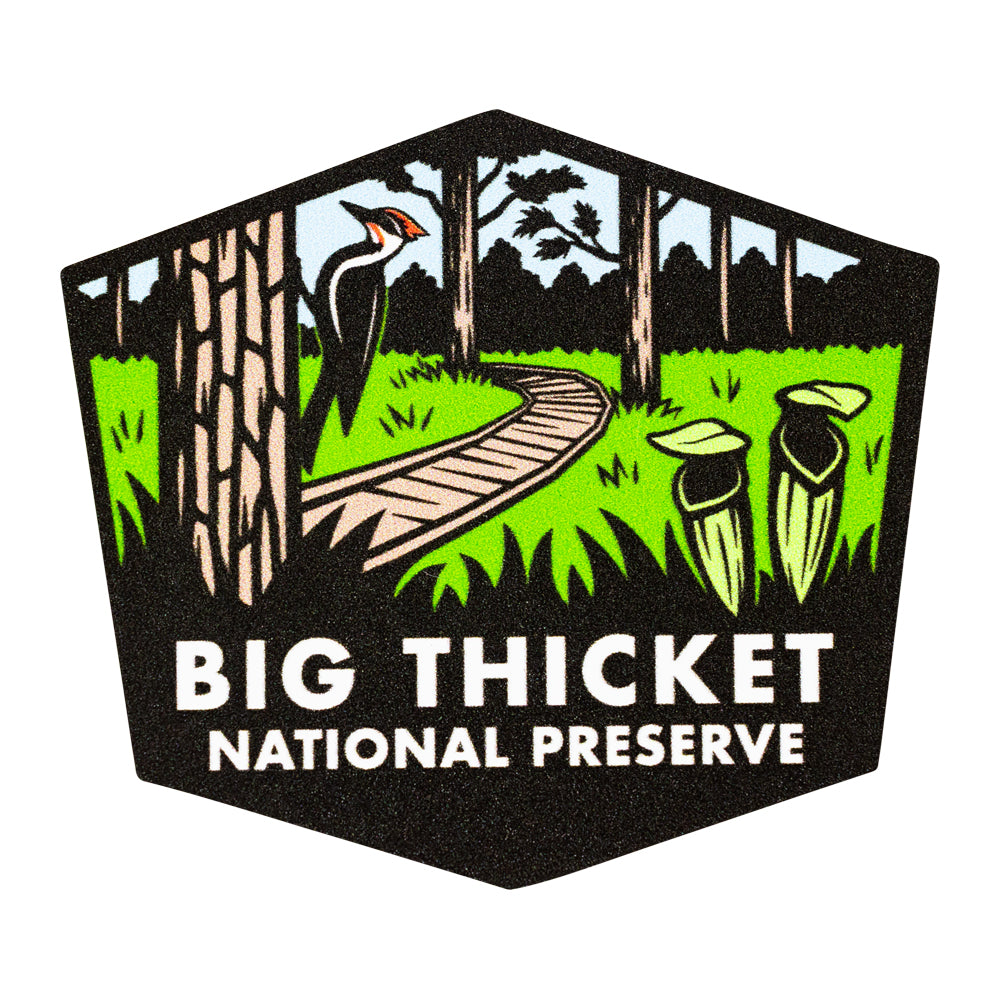 Sticker of Big Thicket National Preserve with a stylized illustration of a path, trees, and a bird.