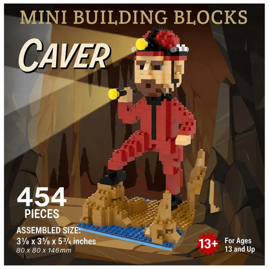 Packaging for a mini building blocks set featuring a cave explorer figure assembled from red, black, tan, yellow, and blue pieces, standing on a rocky base inside a cave scene. Large text reads &