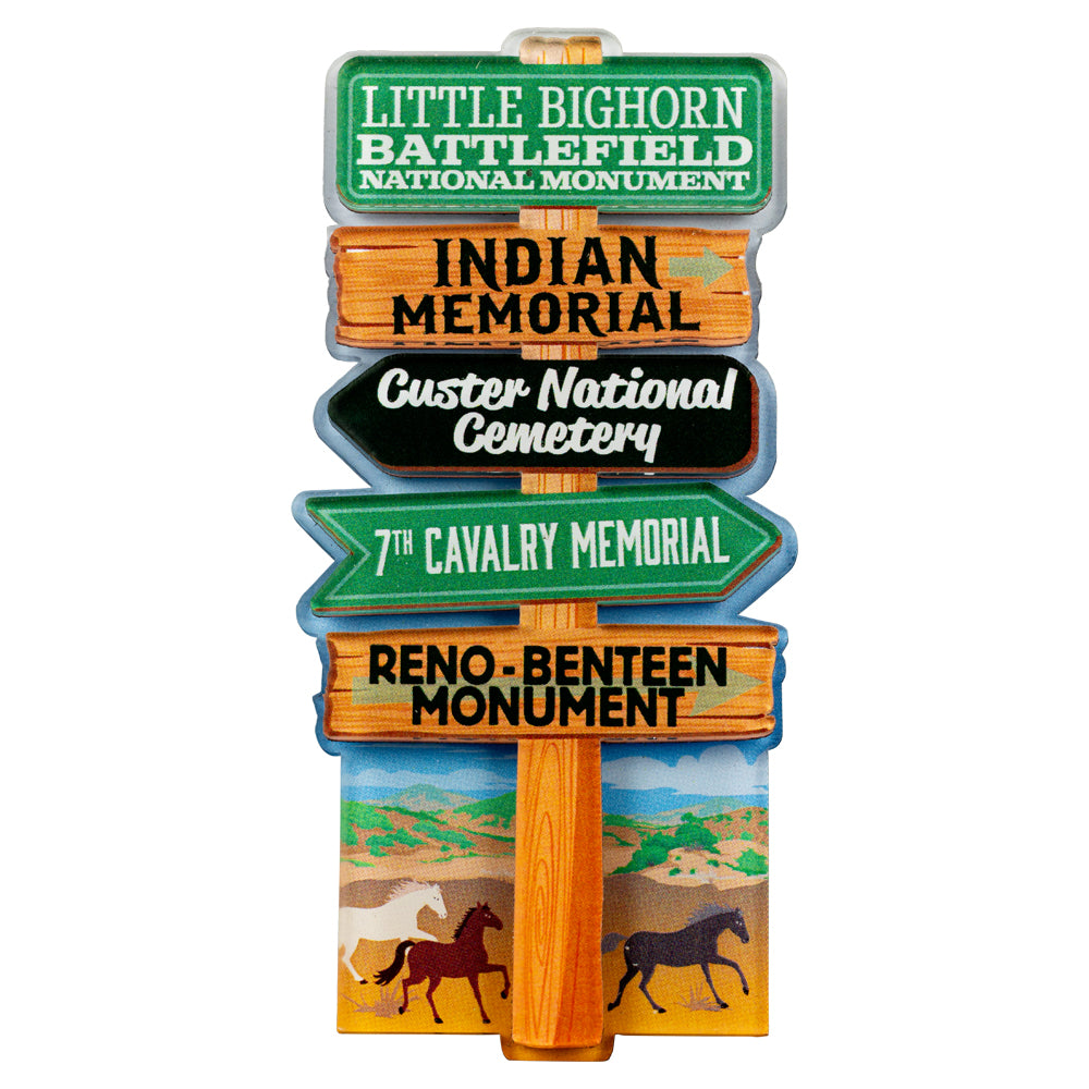 Decorative signpost magnet with directional arrows for various locations at Little Bighorn Battlefield National Monument, on a white background