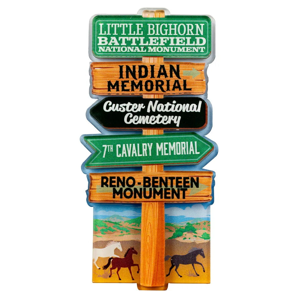 Decorative signpost magnet with directional arrows for various locations at Little Bighorn Battlefield National Monument, on a white background