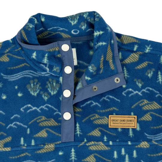 Blue patterned shirt with buttons and a visible Great Sand Dunes National Park & Preserve label on a white background
